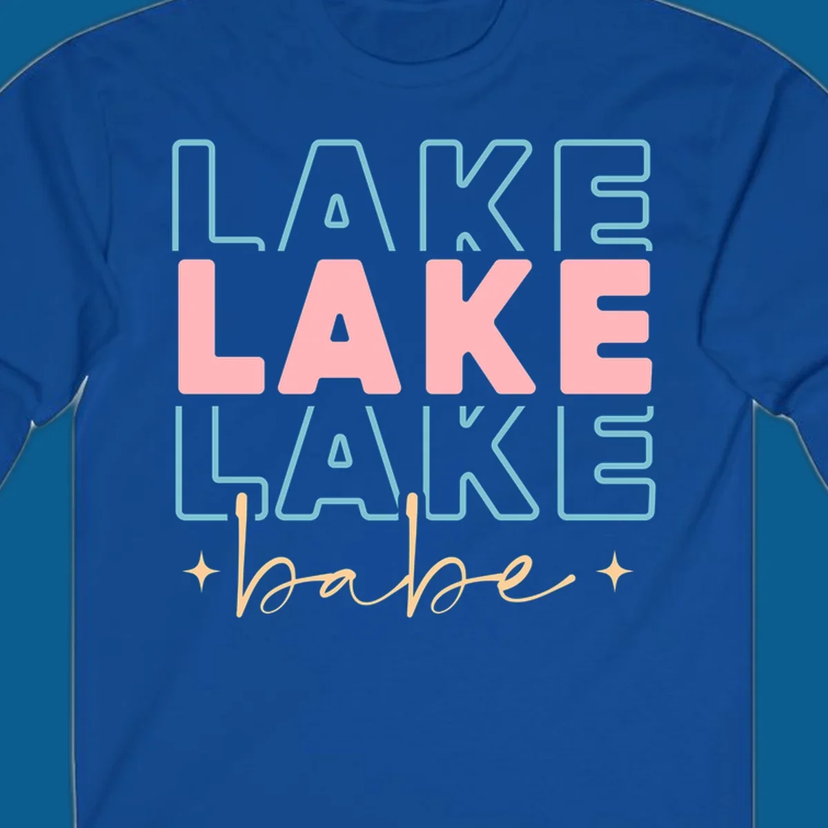 Retro typography design featuring the words LAKE LAKE LAKE and babe, with gold starburst accents.