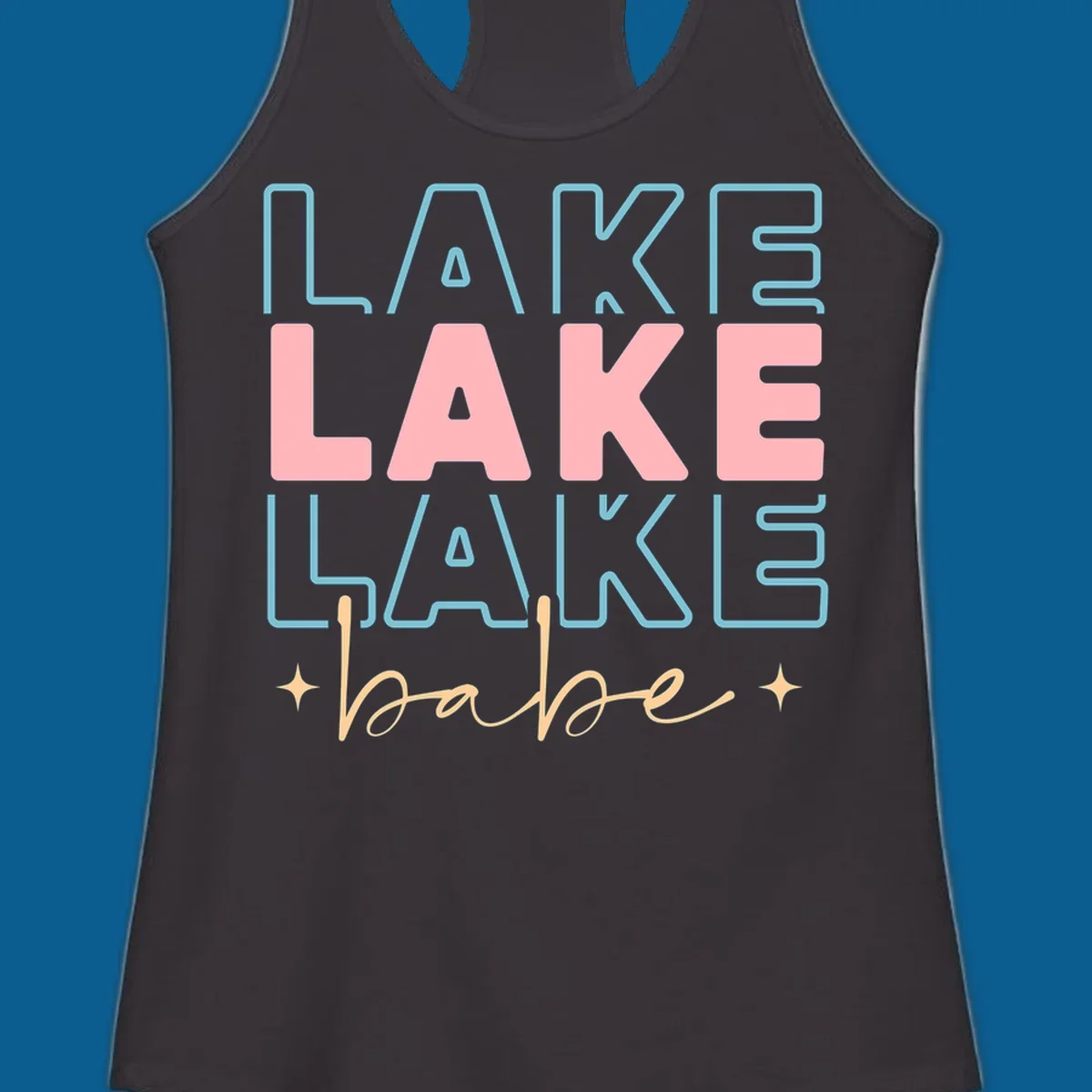 Retro typography design featuring the words LAKE LAKE LAKE and babe, with gold starburst accents.