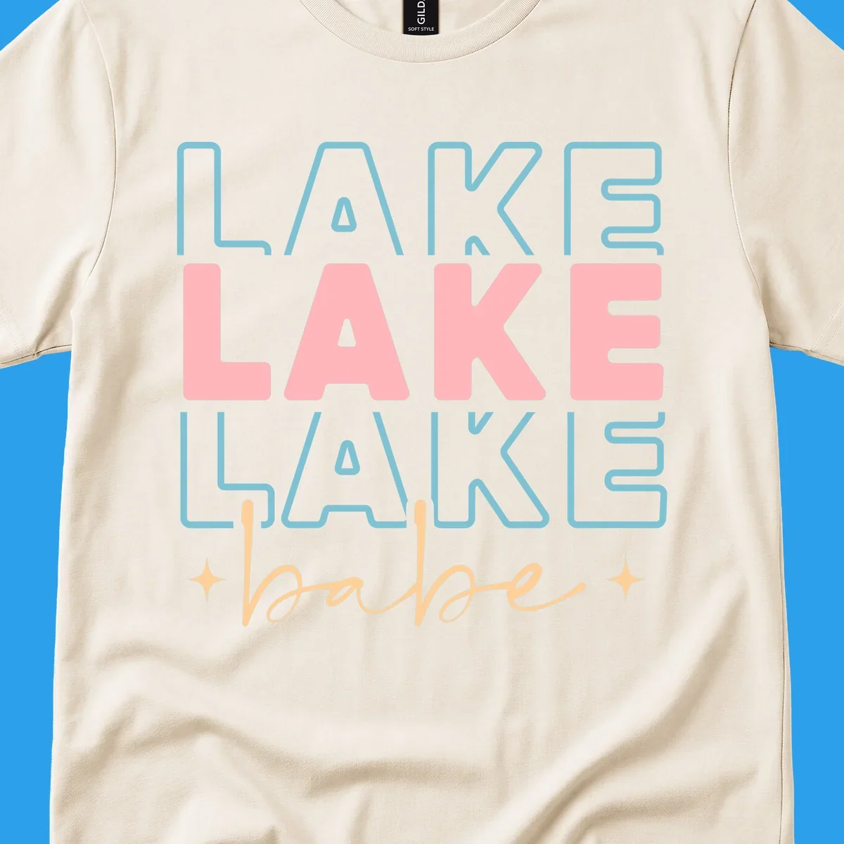 Retro typography design featuring the words LAKE LAKE LAKE and babe, with gold starburst accents.