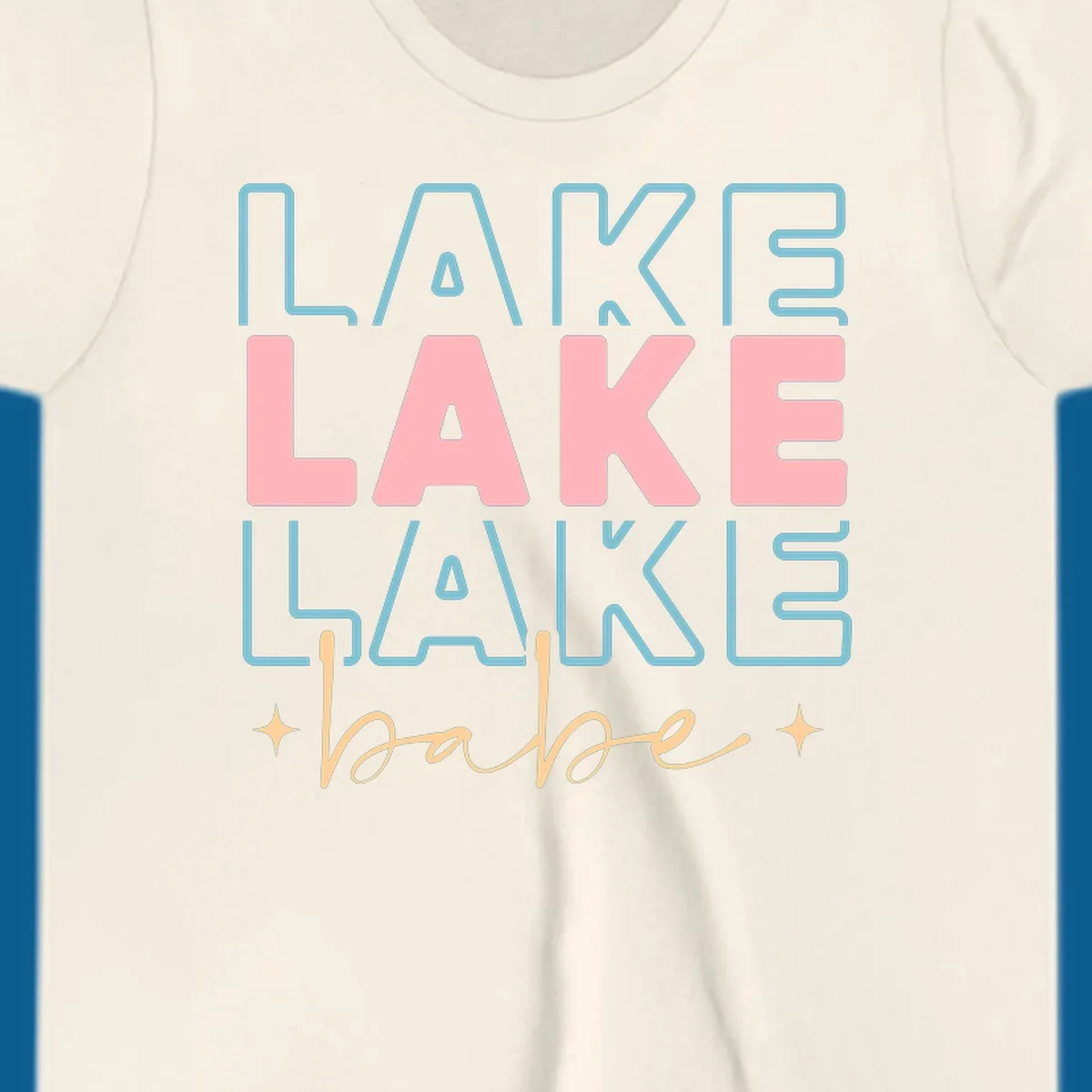 Retro typography design featuring the words LAKE LAKE LAKE and babe, with gold starburst accents.