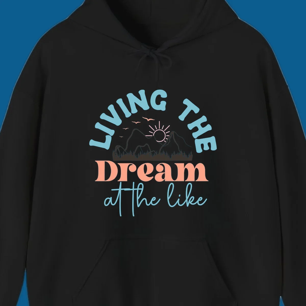 Illustration of mountains with a sunrise and birds above the text 'Living The Dream At The Like'.