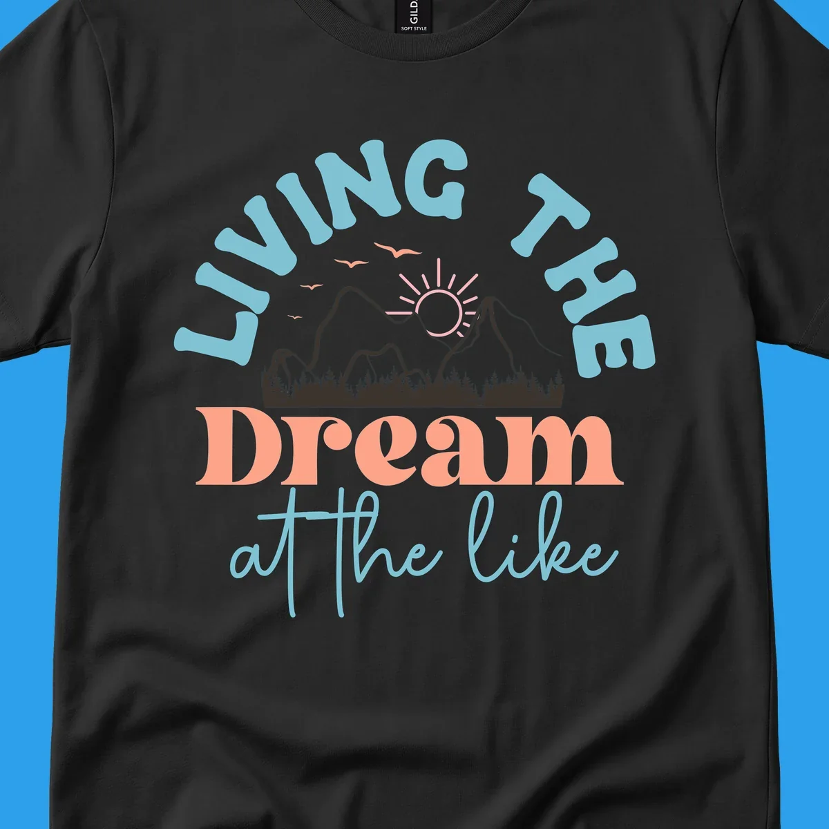 Illustration of mountains with a sunrise and birds above the text 'Living The Dream At The Like'.