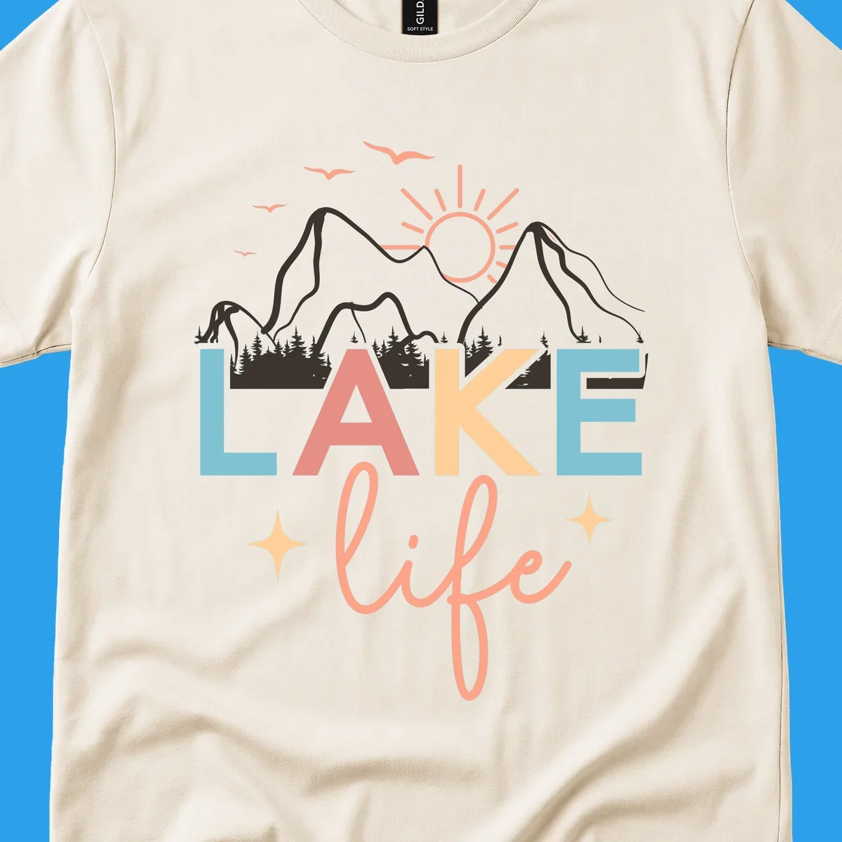 Lake life mountains graphic with colorful text and scenic background.