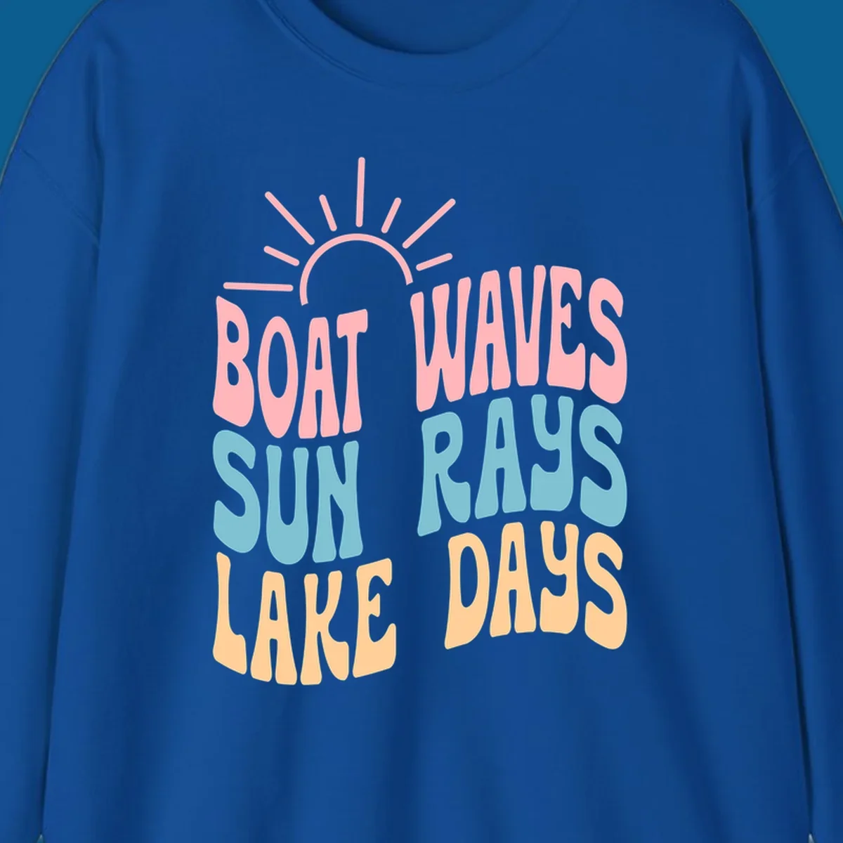 Retro text design featuring 'Boat Waves Sun Rays Lake Days' with sun rays.