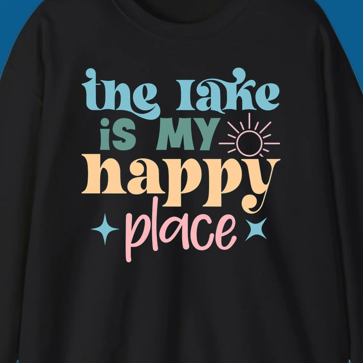 The lake is my happy place text with sun and starbursts, lake-happy-place design