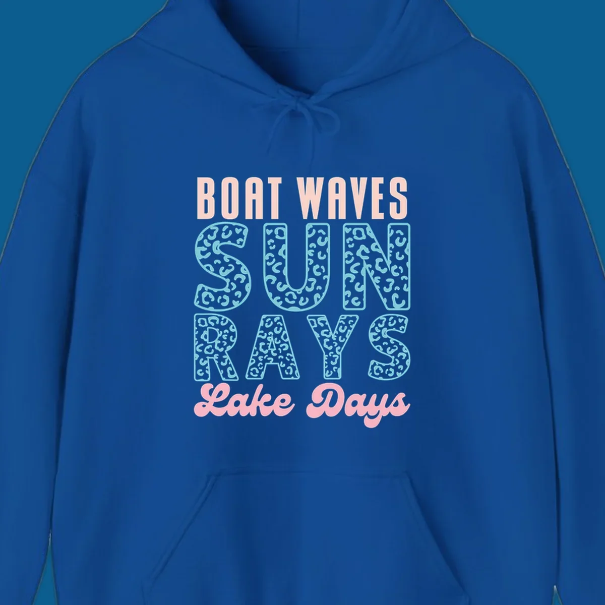 Boat waves sun rays lake days text design with pink and teal leopard print.