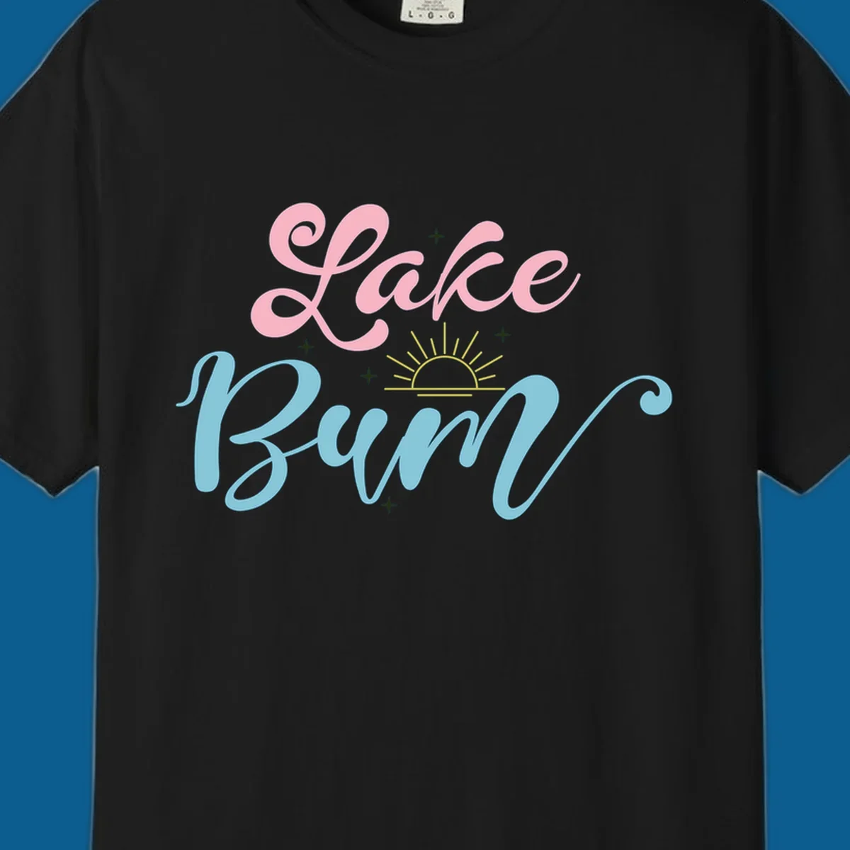Lake Bum text design with a sunset graphic, in pink and blue script.