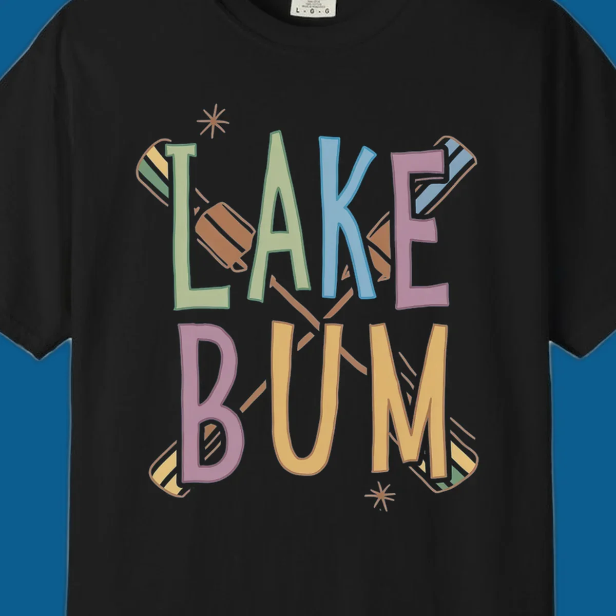 Lake Bum text with crossed oars and starbursts in colorful hand-drawn lettering.