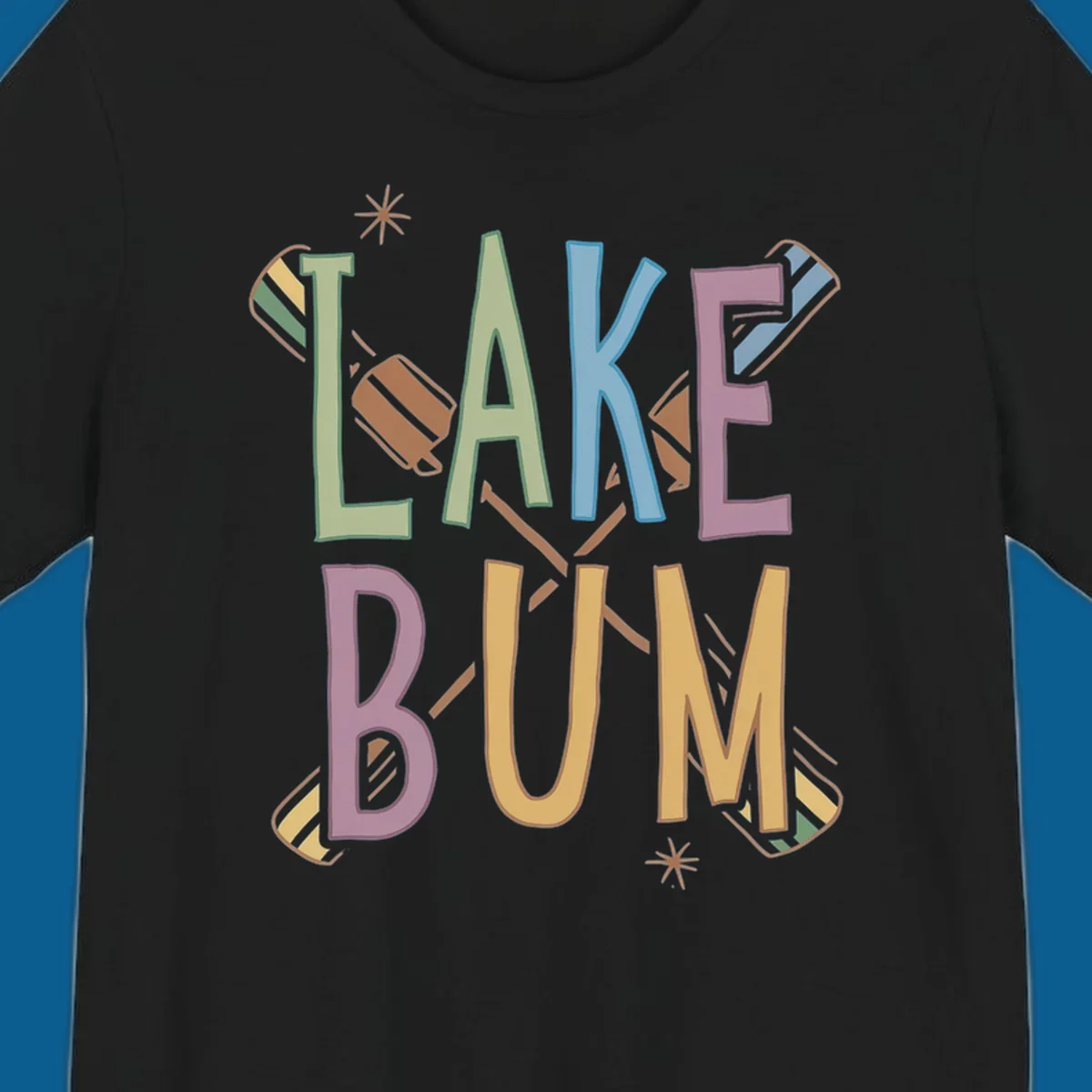 Lake Bum text with crossed oars and starbursts in colorful hand-drawn lettering.