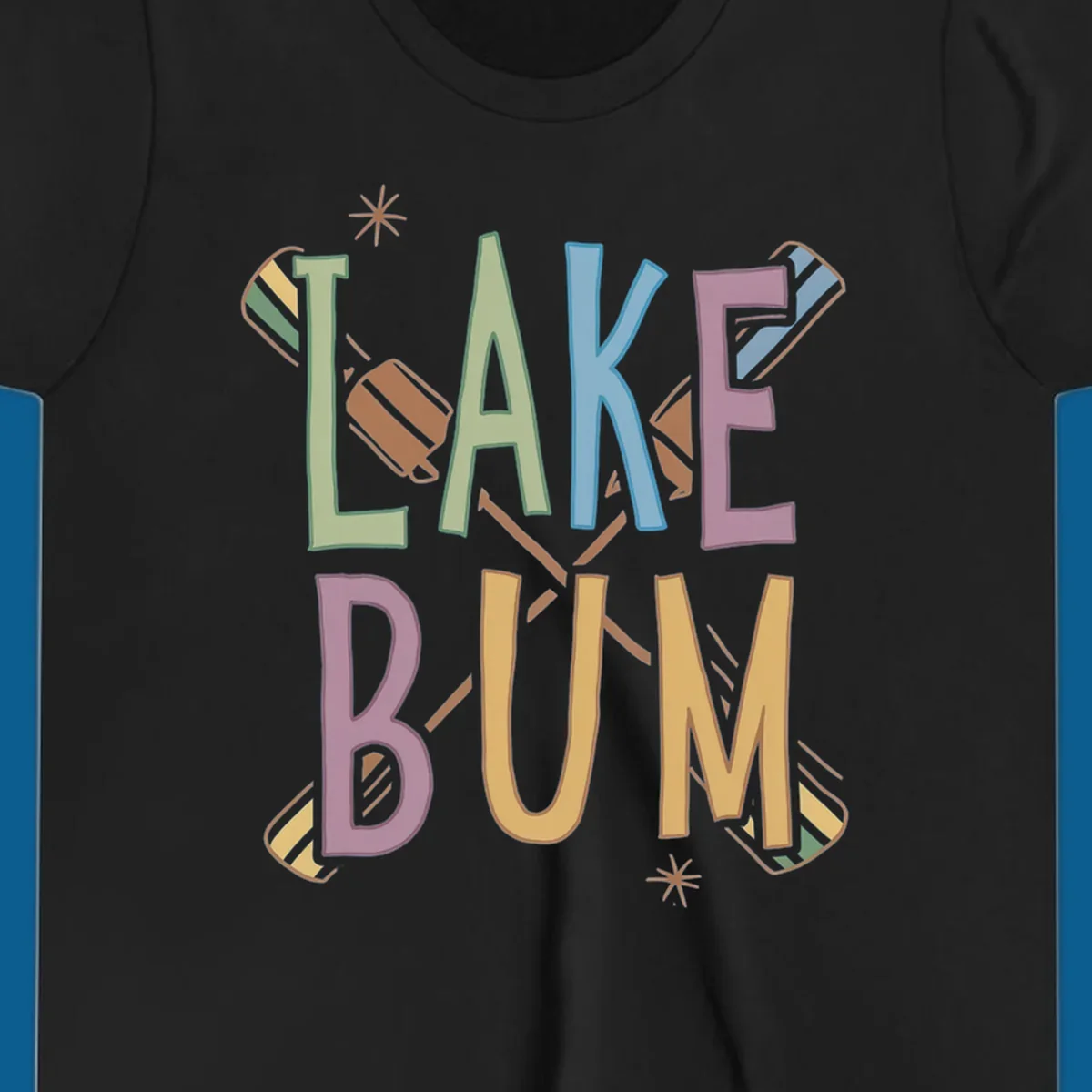 Lake Bum text with crossed oars and starbursts in colorful hand-drawn lettering.