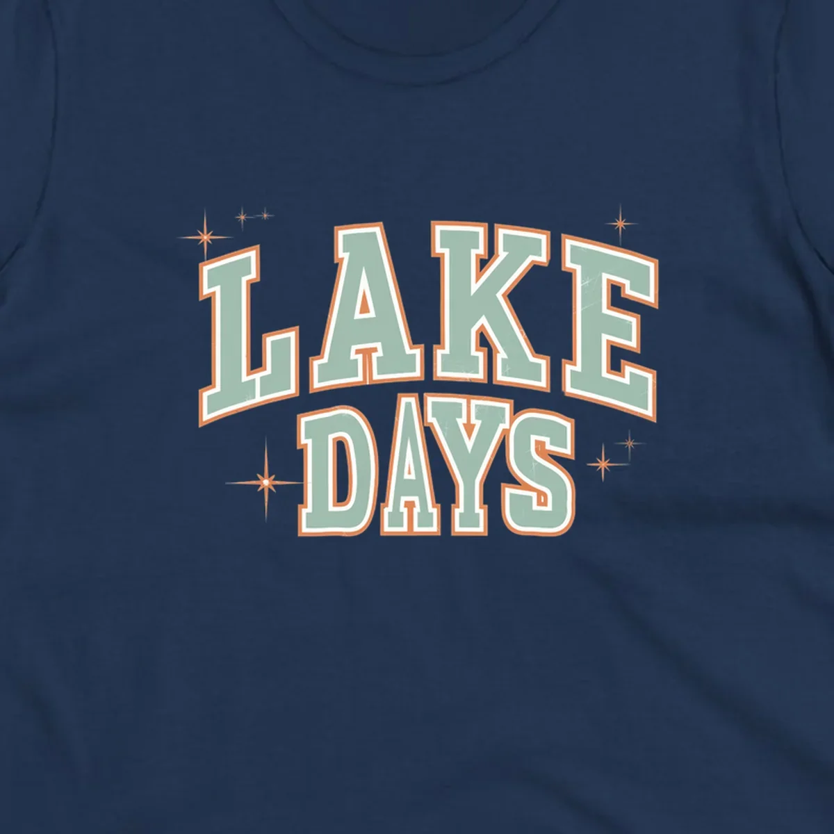 Retro varsity style LAKE DAYS text with starbursts graphic.