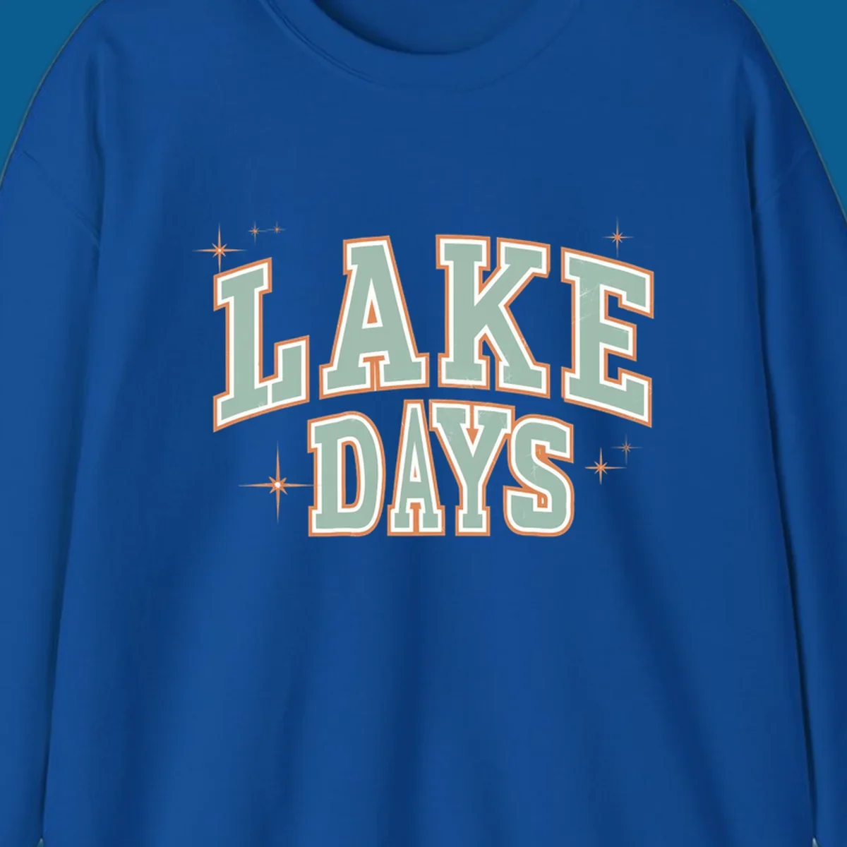Retro varsity style LAKE DAYS text with starbursts graphic.