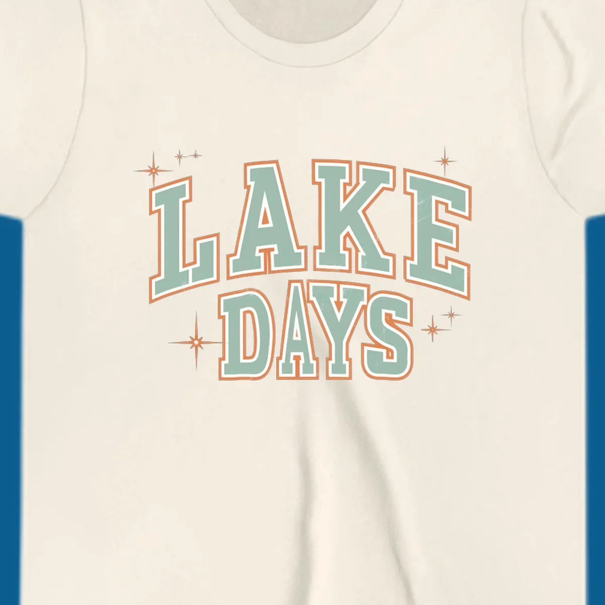 Retro varsity style LAKE DAYS text with starbursts graphic.