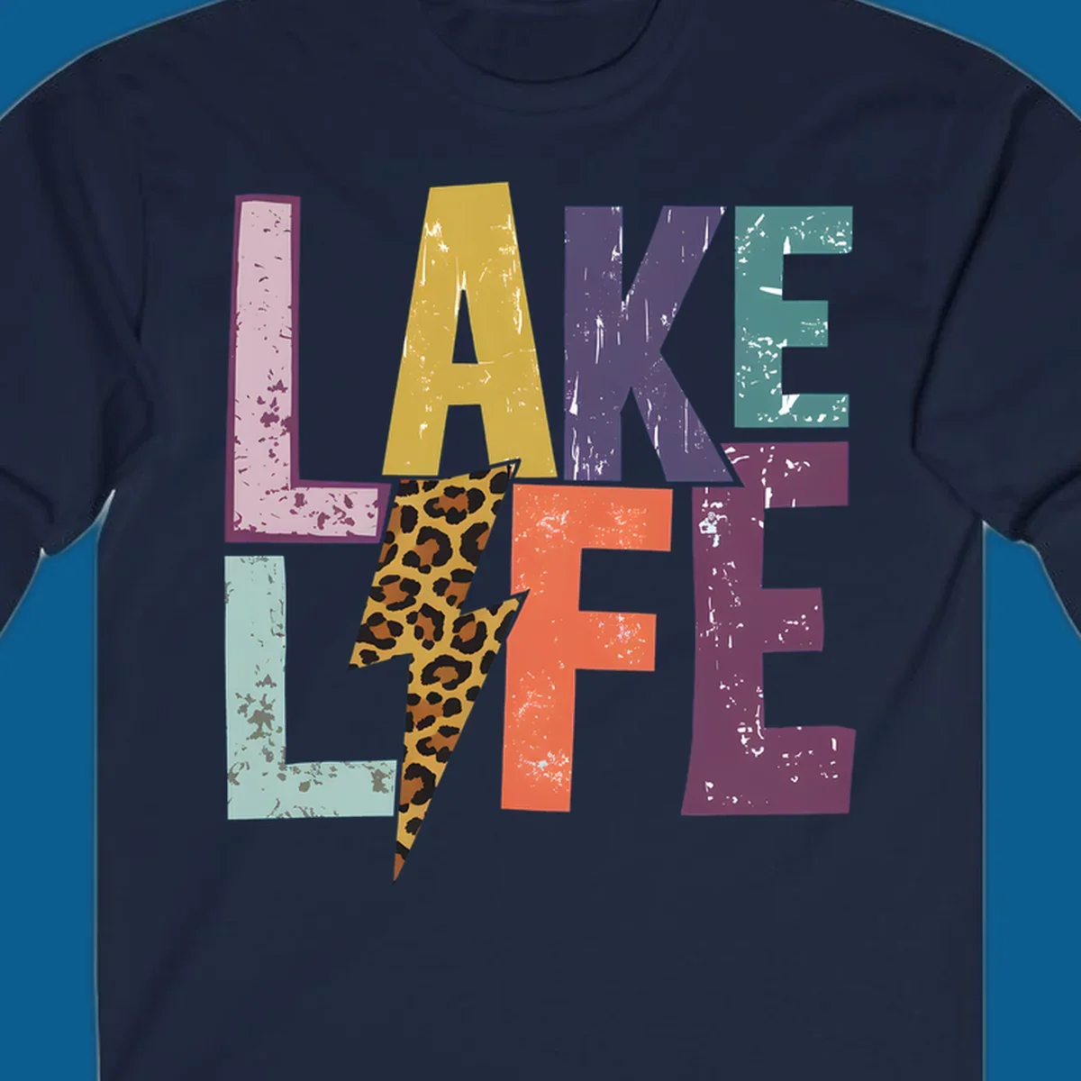 Distressed letters spelling LAKE LIFE with a leopard print lightning bolt, lake-life-style.