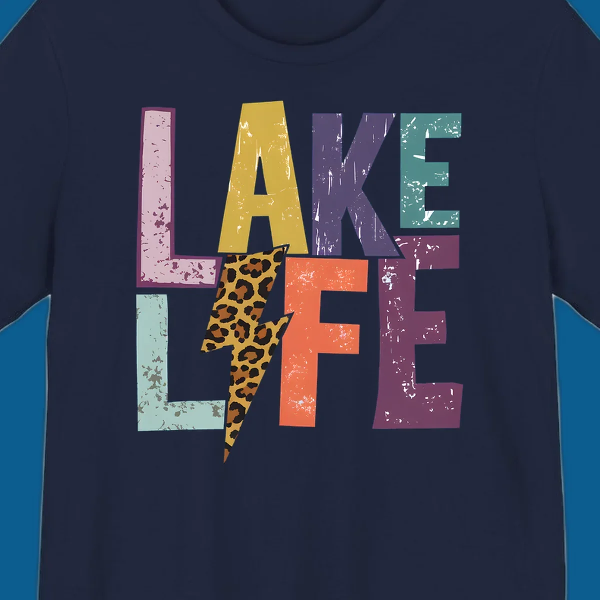 Distressed letters spelling LAKE LIFE with a leopard print lightning bolt, lake-life-style.