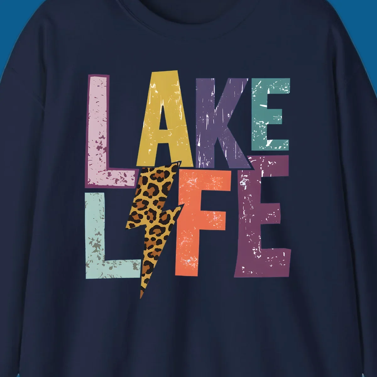 Distressed letters spelling LAKE LIFE with a leopard print lightning bolt, lake-life-style.