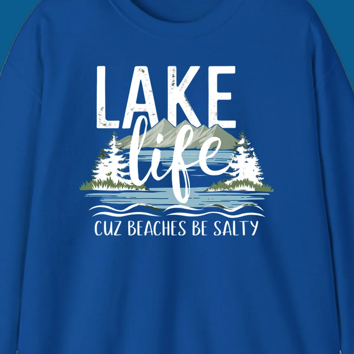 Lake life text with mountains, trees, and water; cuz beaches be salty. Lake-life-salty design.