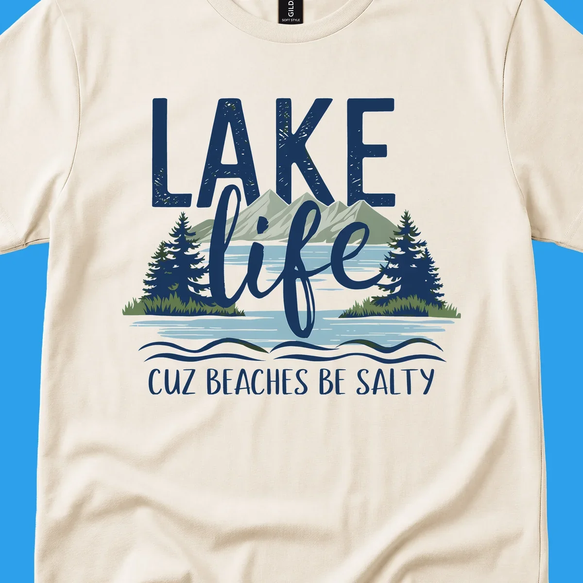 Lake life text with mountains, trees, and water; cuz beaches be salty. Lake-life-salty design.