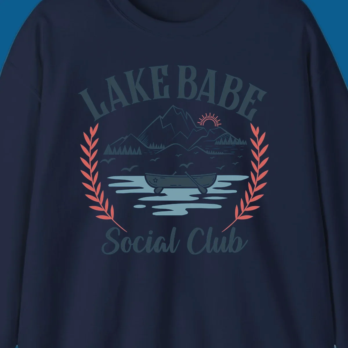 Lake Babe Social Club illustration with mountains, canoe, sun, and birds.