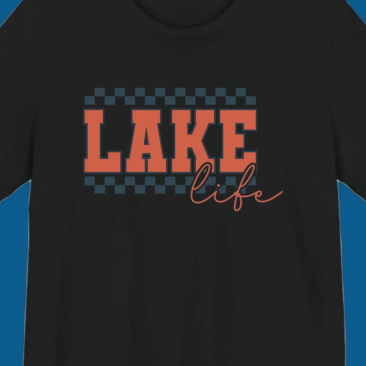 Coral block letters spelling LAKE with script "life" below, bordered by checkerboard. Lake life style.