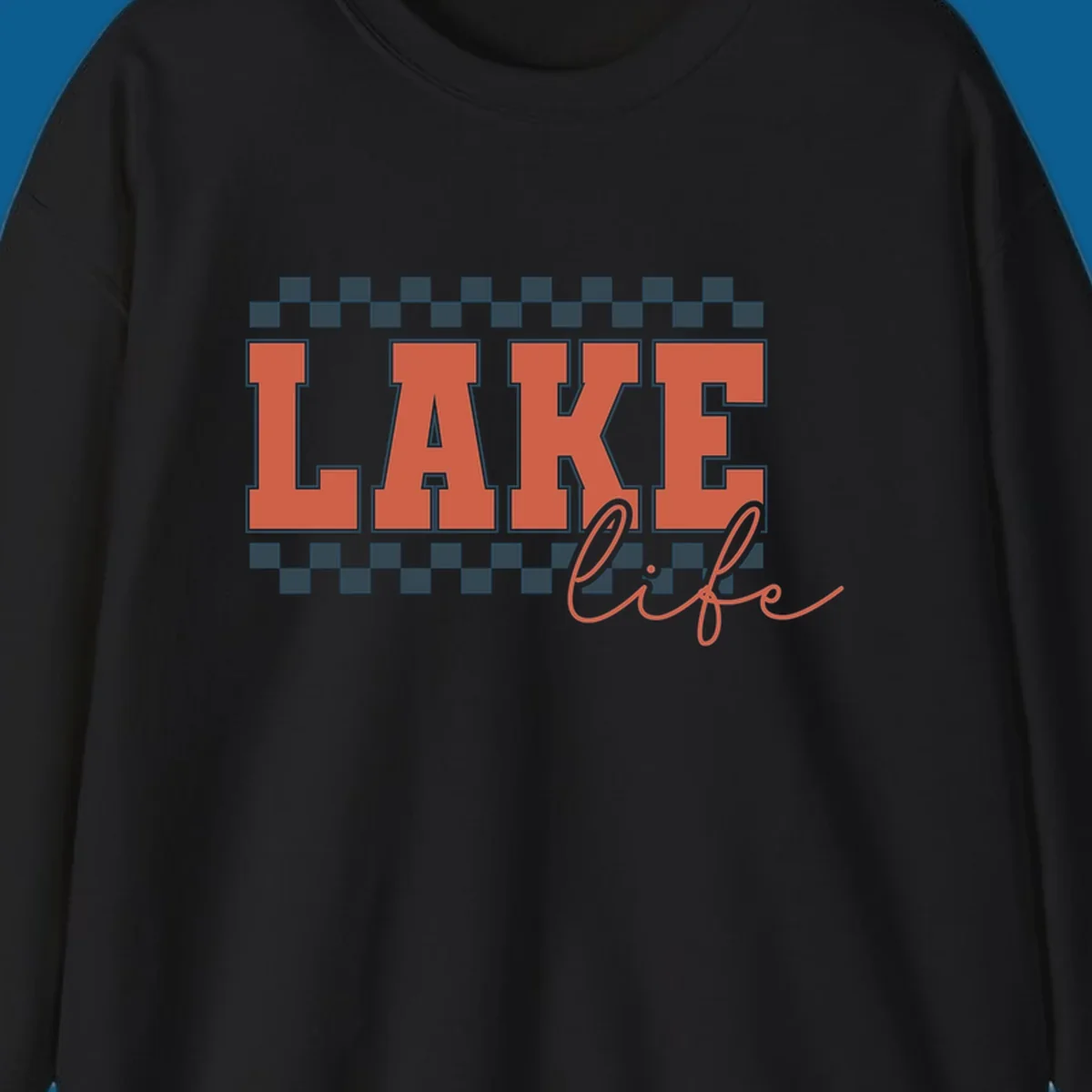 Coral block letters spelling LAKE with script "life" below, bordered by checkerboard. Lake life style.