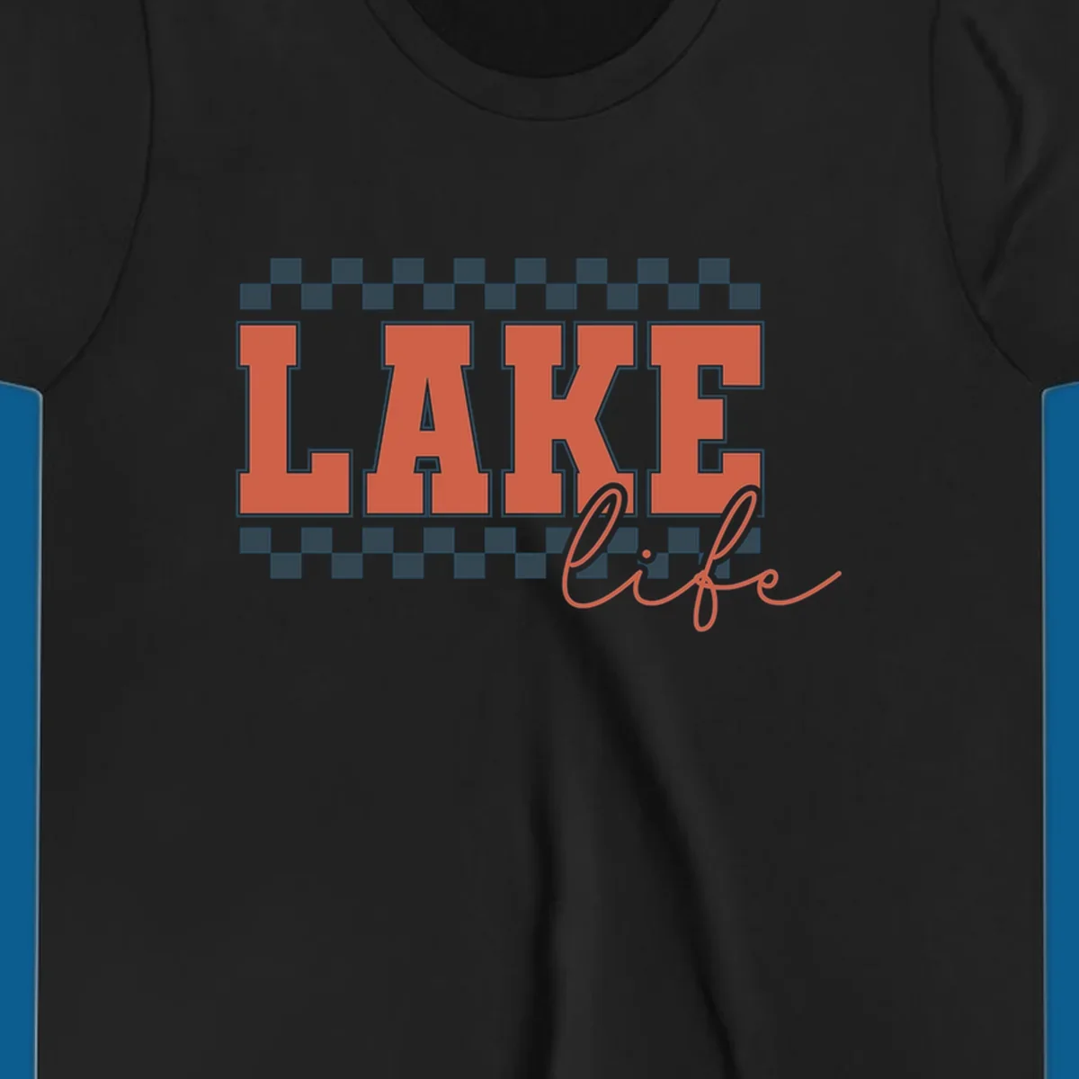 Coral block letters spelling LAKE with script "life" below, bordered by checkerboard. Lake life style.