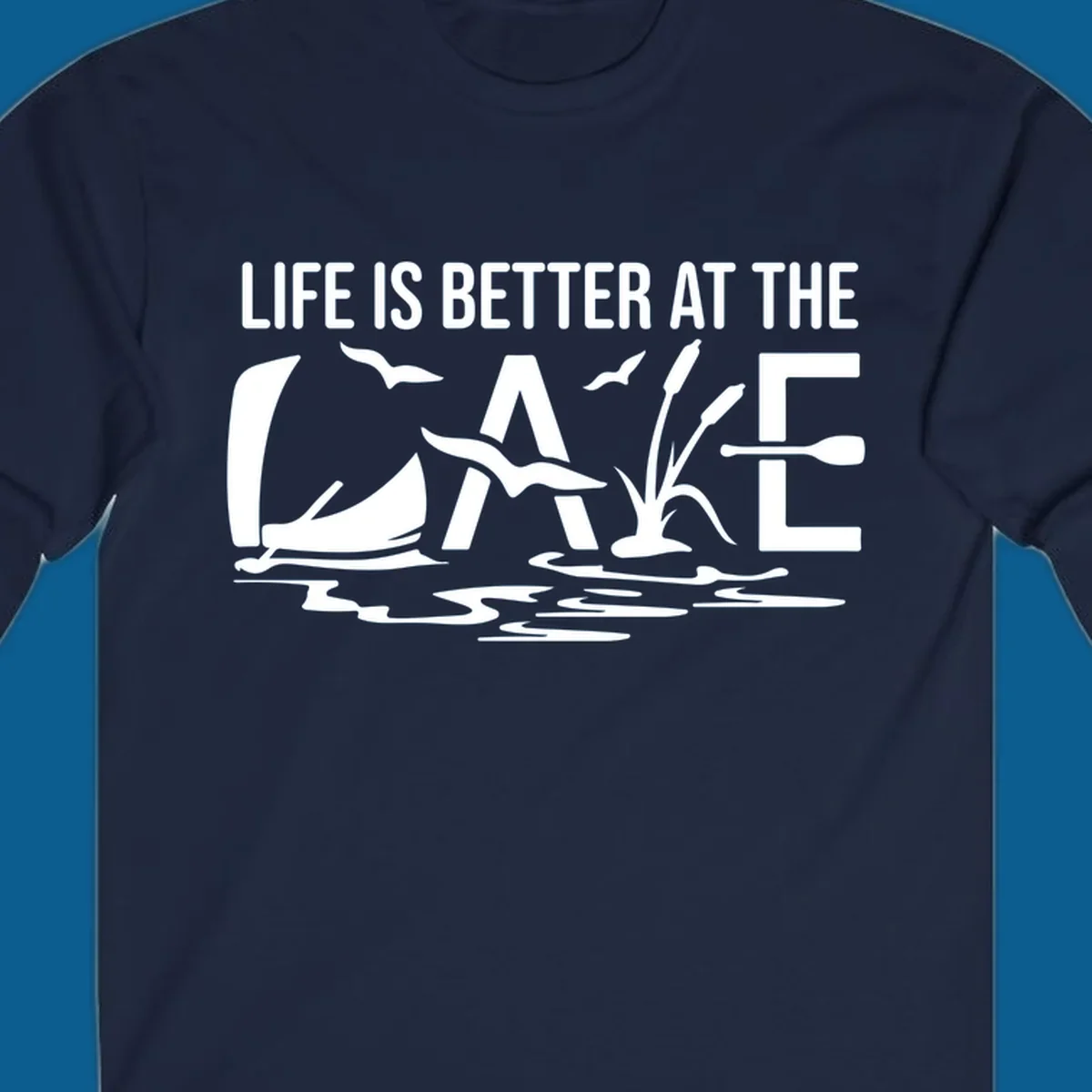 Life Is Better At The Lake design with sailboat, birds, reeds, paddle, and text.