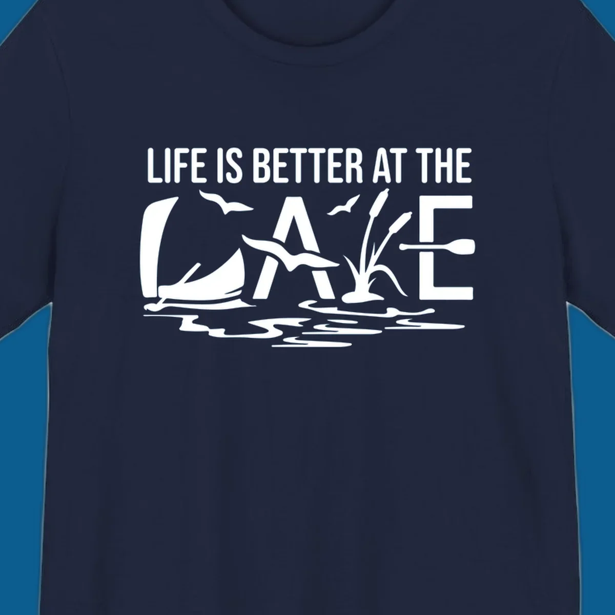 Life Is Better At The Lake design with sailboat, birds, reeds, paddle, and text.