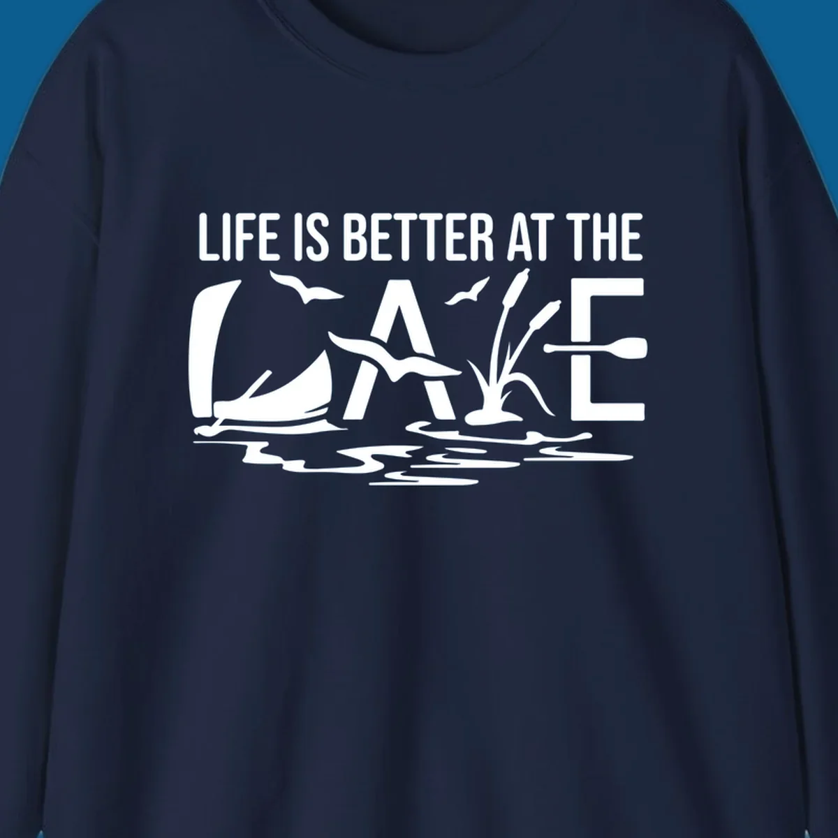 Life Is Better At The Lake design with sailboat, birds, reeds, paddle, and text.