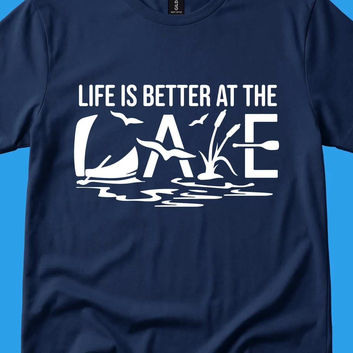 Life Is Better At The Lake design with sailboat, birds, reeds, paddle, and text.