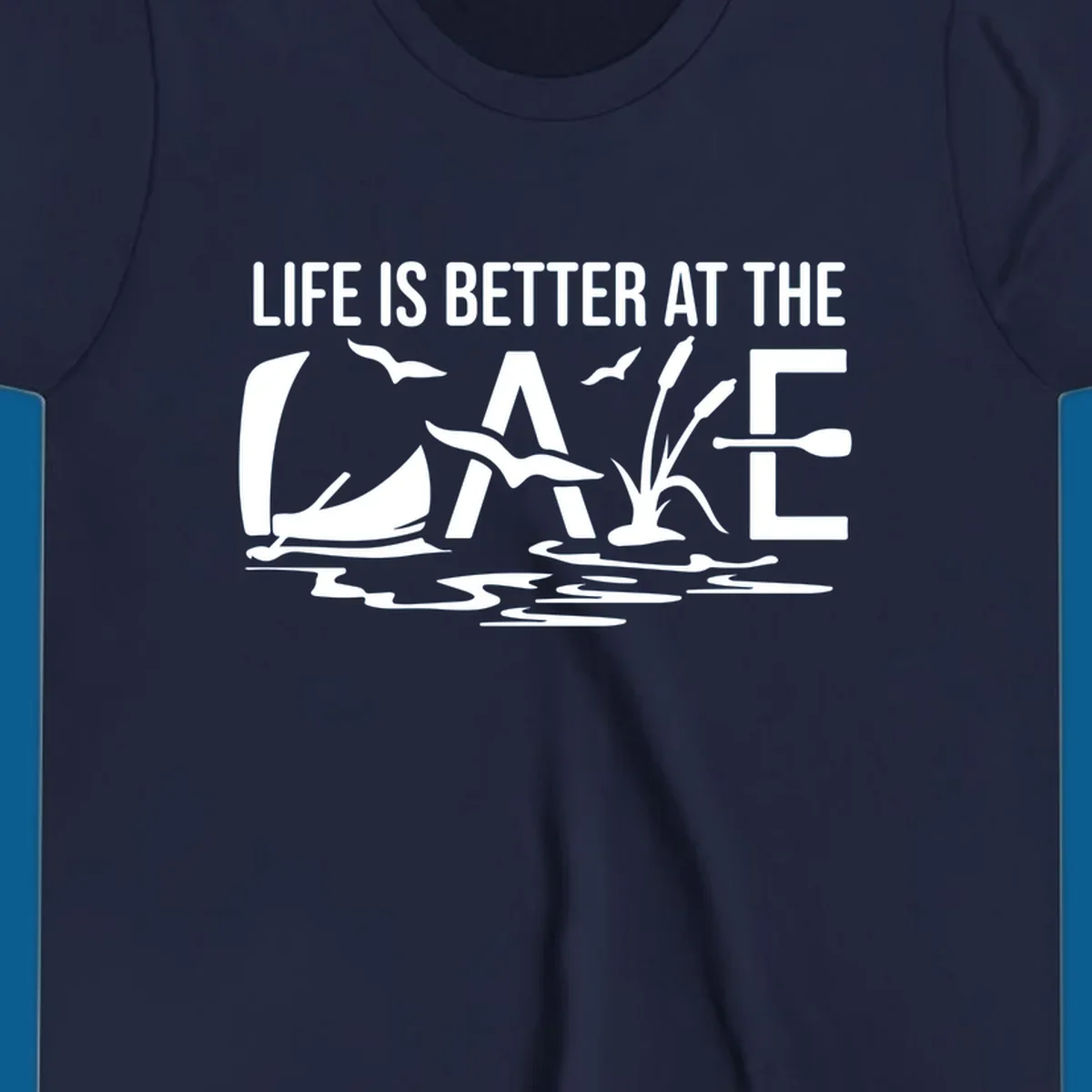 Life Is Better At The Lake design with sailboat, birds, reeds, paddle, and text.