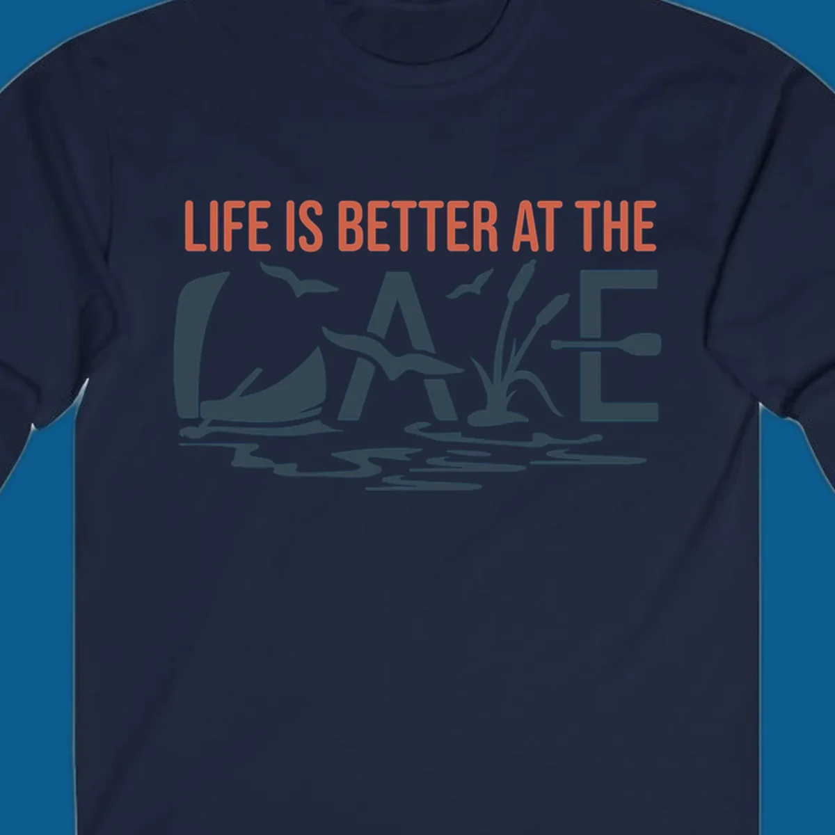 Graphic text design 'LIFE IS BETTER AT THE LAKE' with sailboat, birds, cattails, and paddle elements.