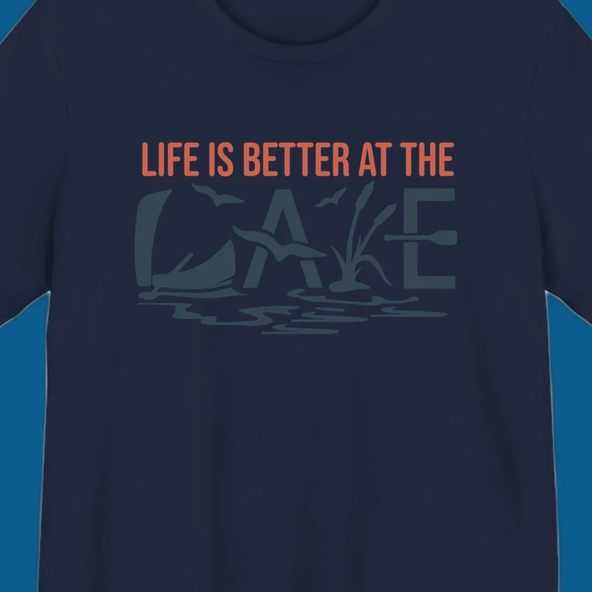 Graphic text design 'LIFE IS BETTER AT THE LAKE' with sailboat, birds, cattails, and paddle elements.
