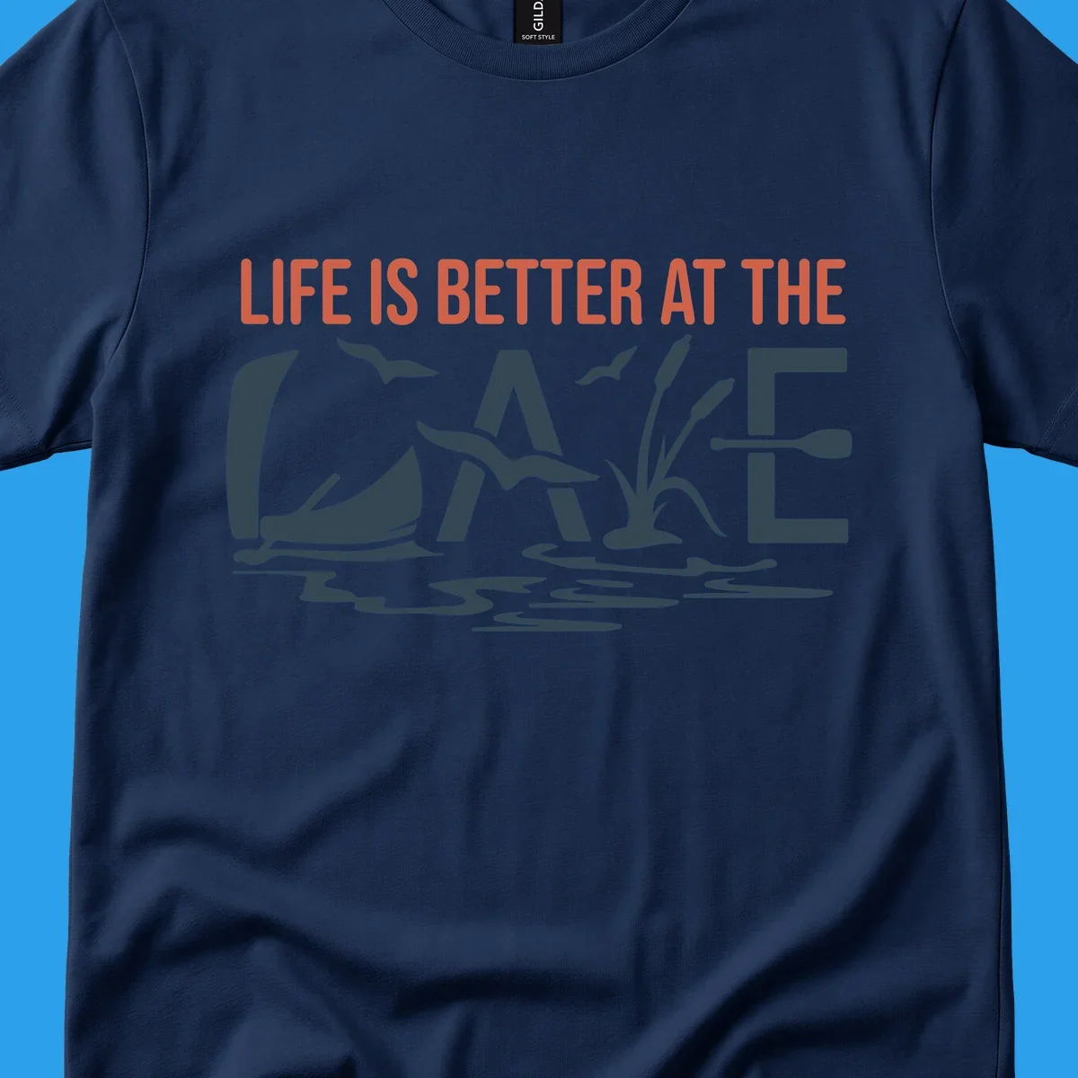 Graphic text design 'LIFE IS BETTER AT THE LAKE' with sailboat, birds, cattails, and paddle elements.