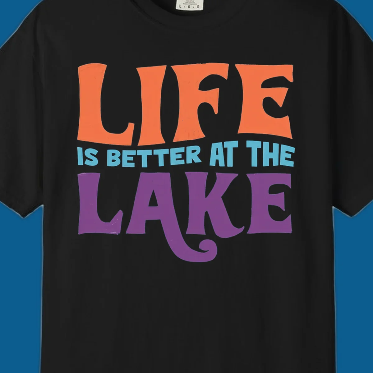 Retro typography design stating "LIFE IS BETTER AT THE LAKE" in orange, teal, and purple.