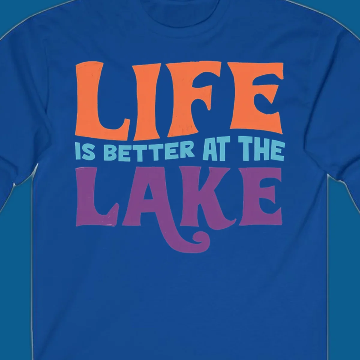 Retro typography design stating "LIFE IS BETTER AT THE LAKE" in orange, teal, and purple.