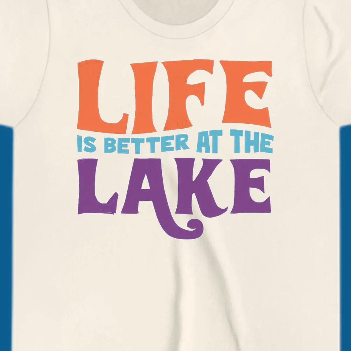 Retro typography design stating "LIFE IS BETTER AT THE LAKE" in orange, teal, and purple.