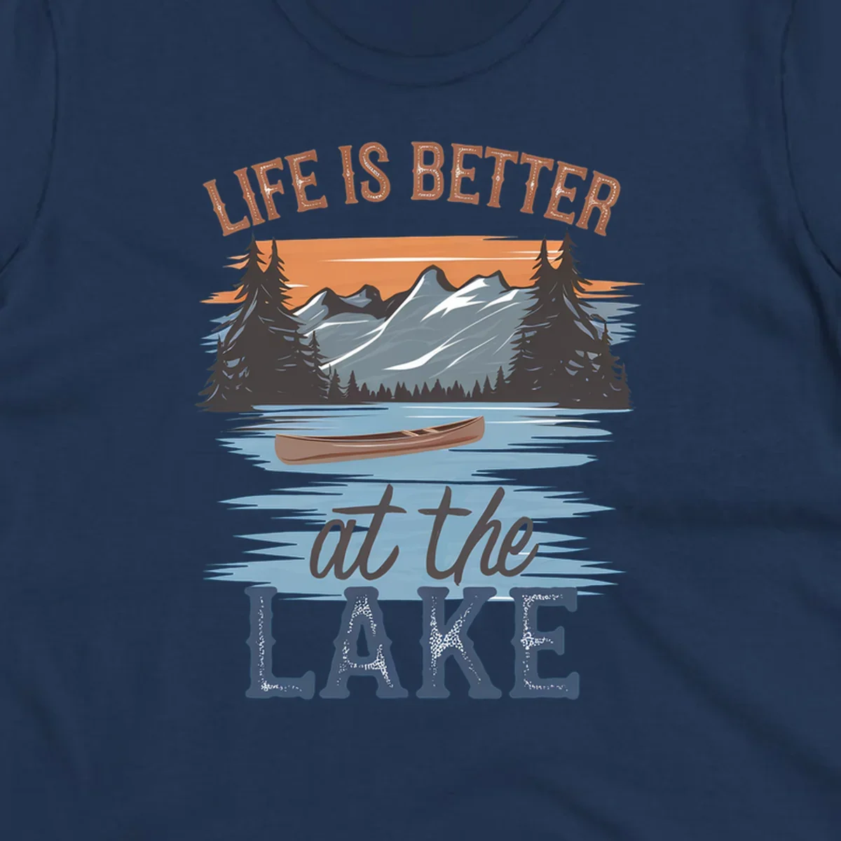 Life is better at the lake scenic design with mountains, canoe, and text.
