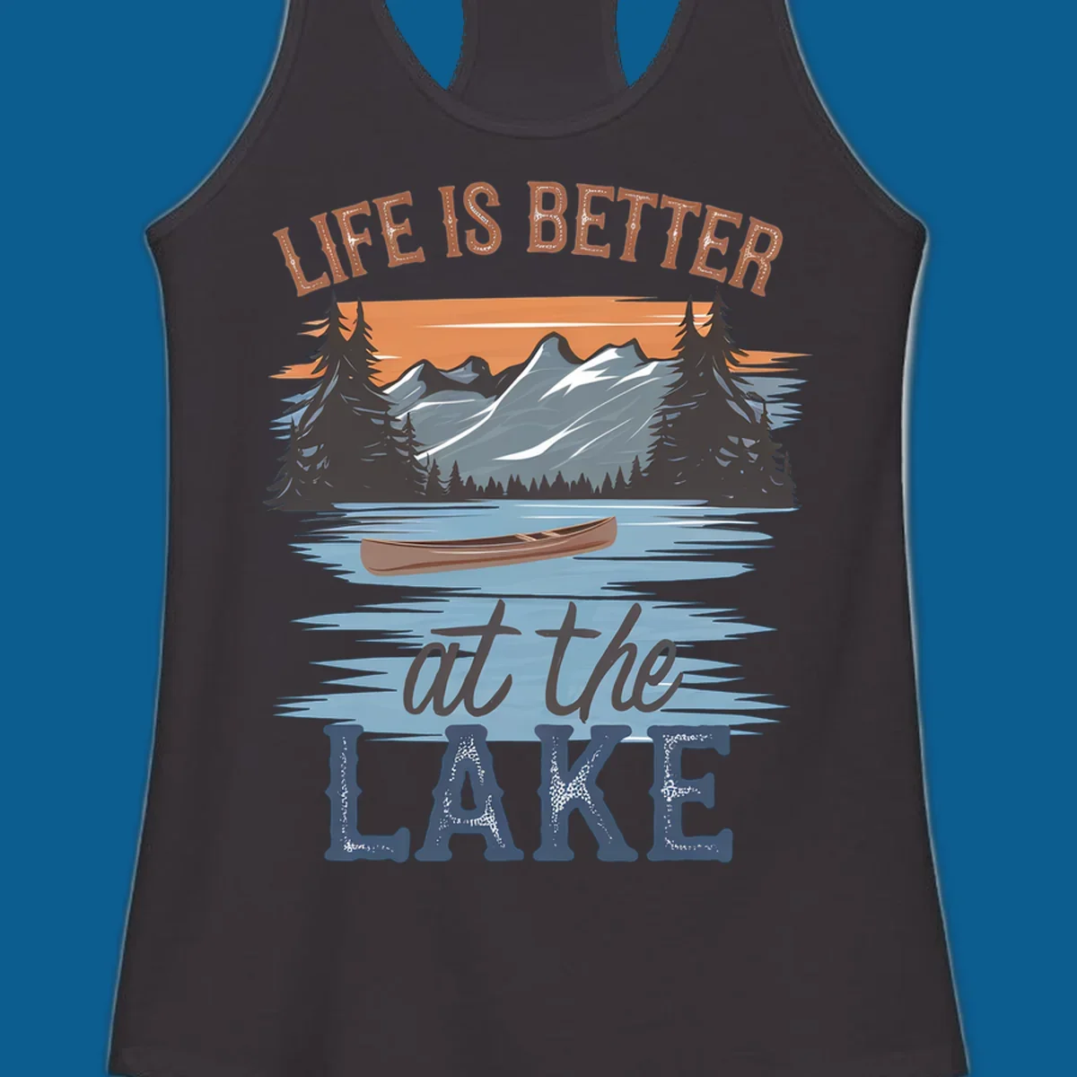 Life is better at the lake scenic design with mountains, canoe, and text.
