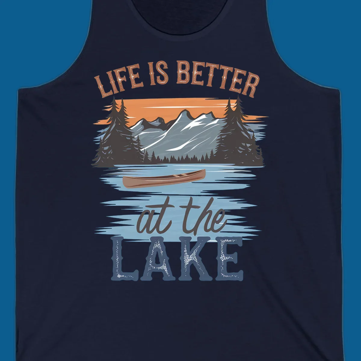 Life is better at the lake scenic design with mountains, canoe, and text.