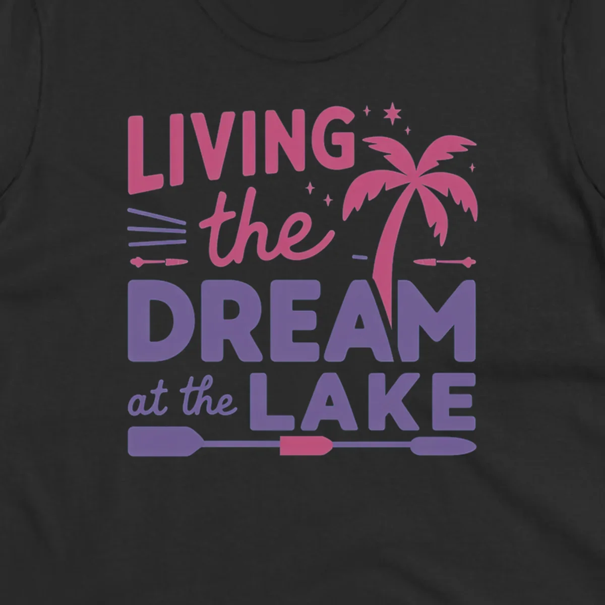 Living the dream at the lake text with palm tree and oars graphic