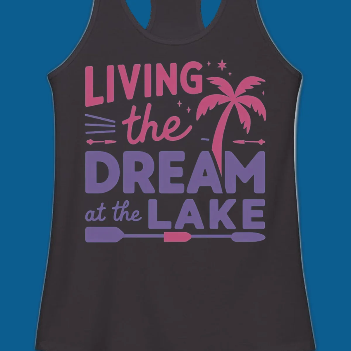 Living the dream at the lake text with palm tree and oars graphic
