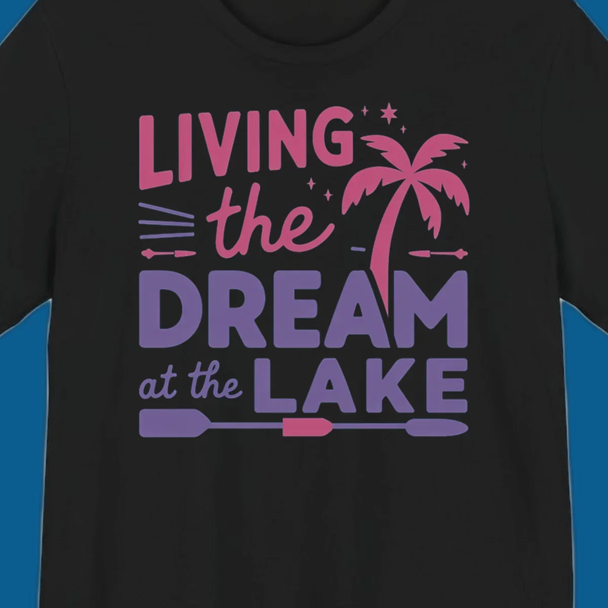 Living the dream at the lake text with palm tree and oars graphic