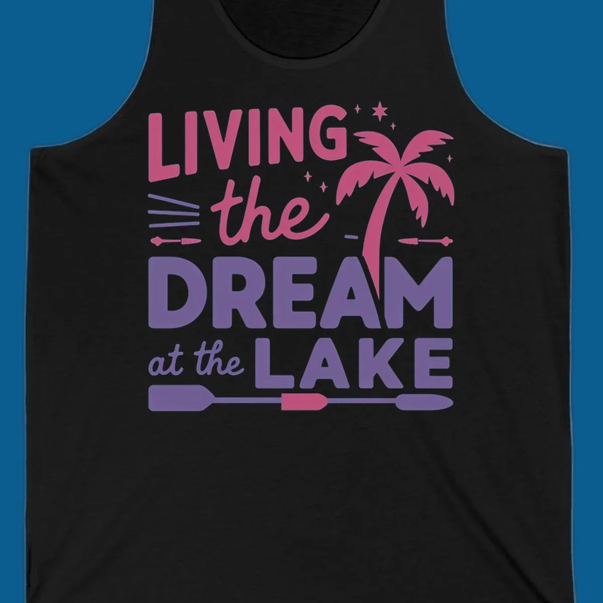 Living the dream at the lake text with palm tree and oars graphic
