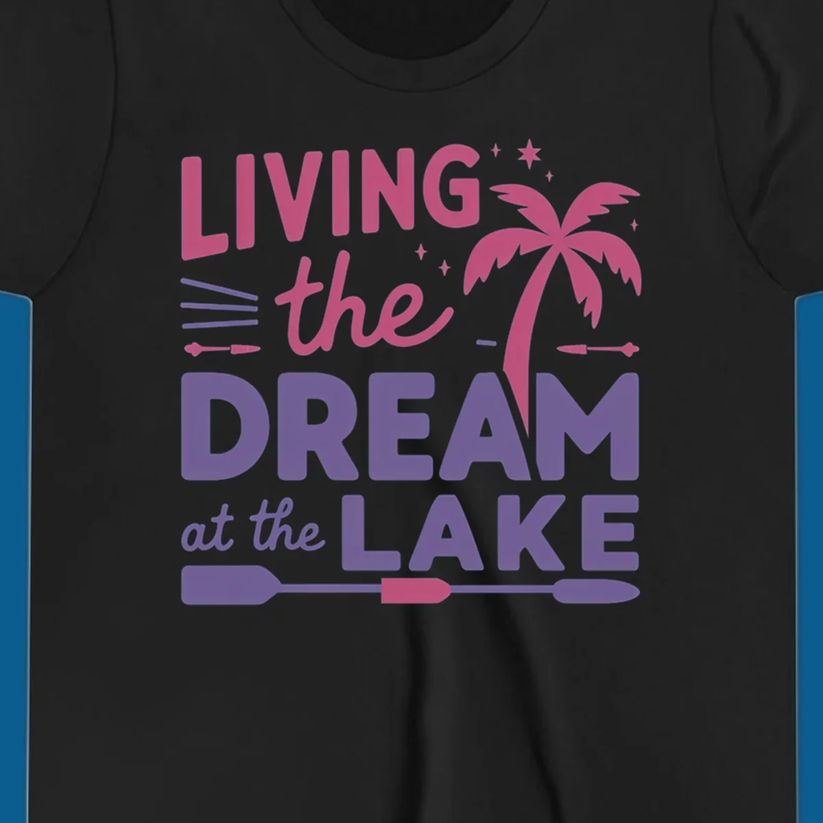 Living the dream at the lake text with palm tree and oars graphic