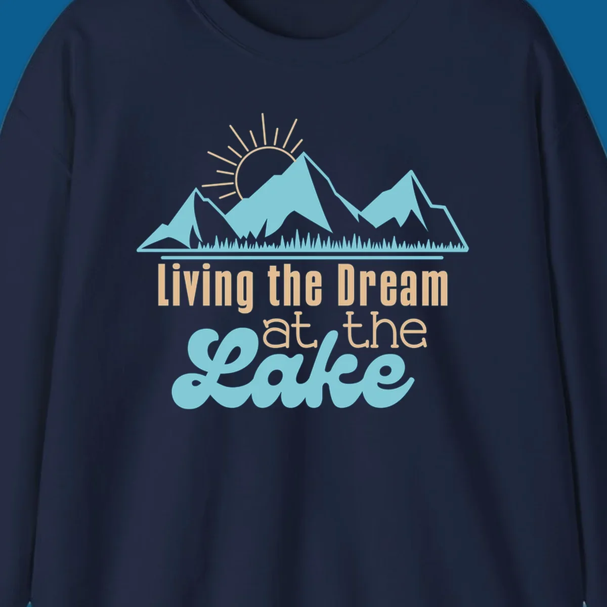 Scenic mountain range with sun and text 'Living the Dream at the Lake'.