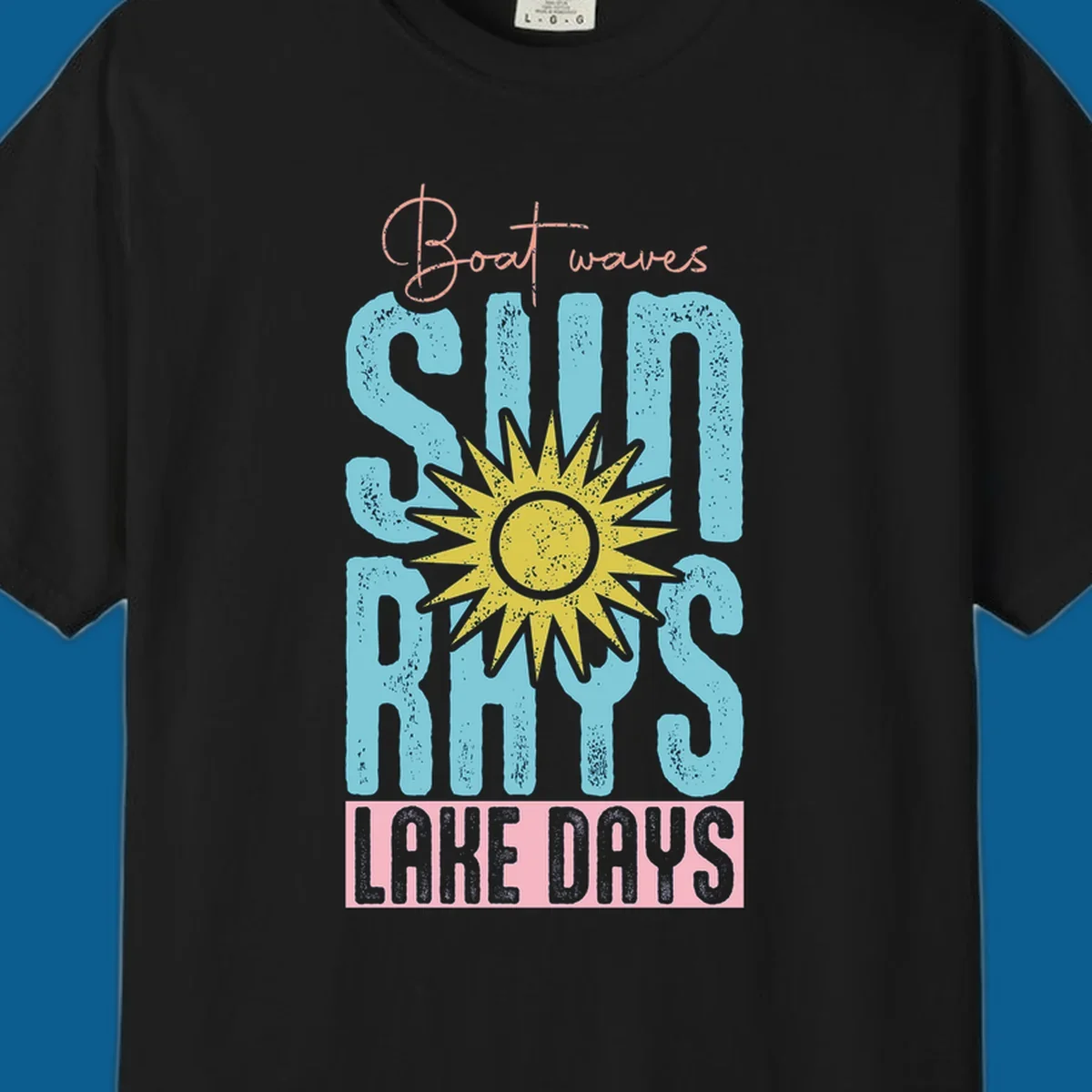 Boat waves sun rays lake days text design with a distressed sun illustration.