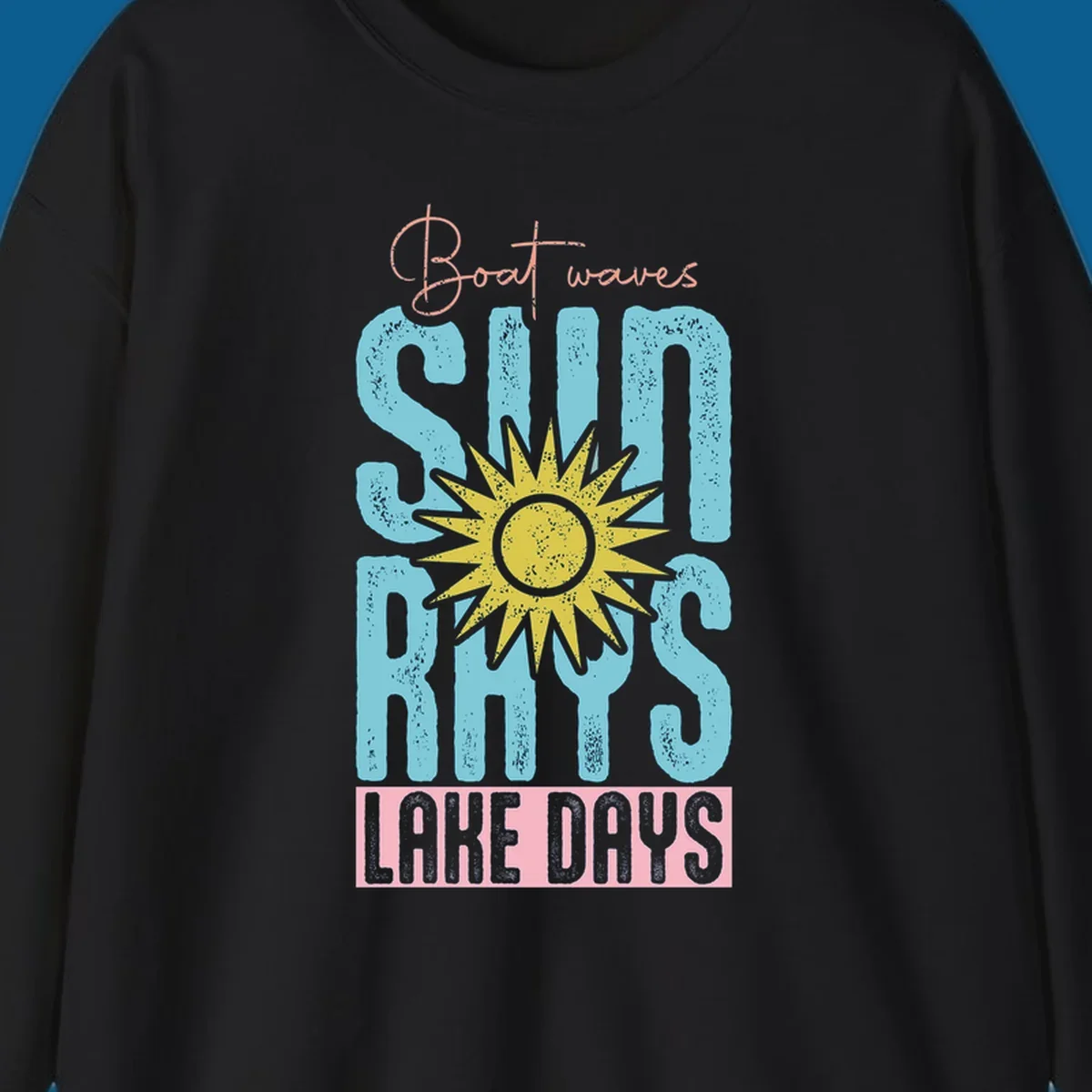 Boat waves sun rays lake days text design with a distressed sun illustration.