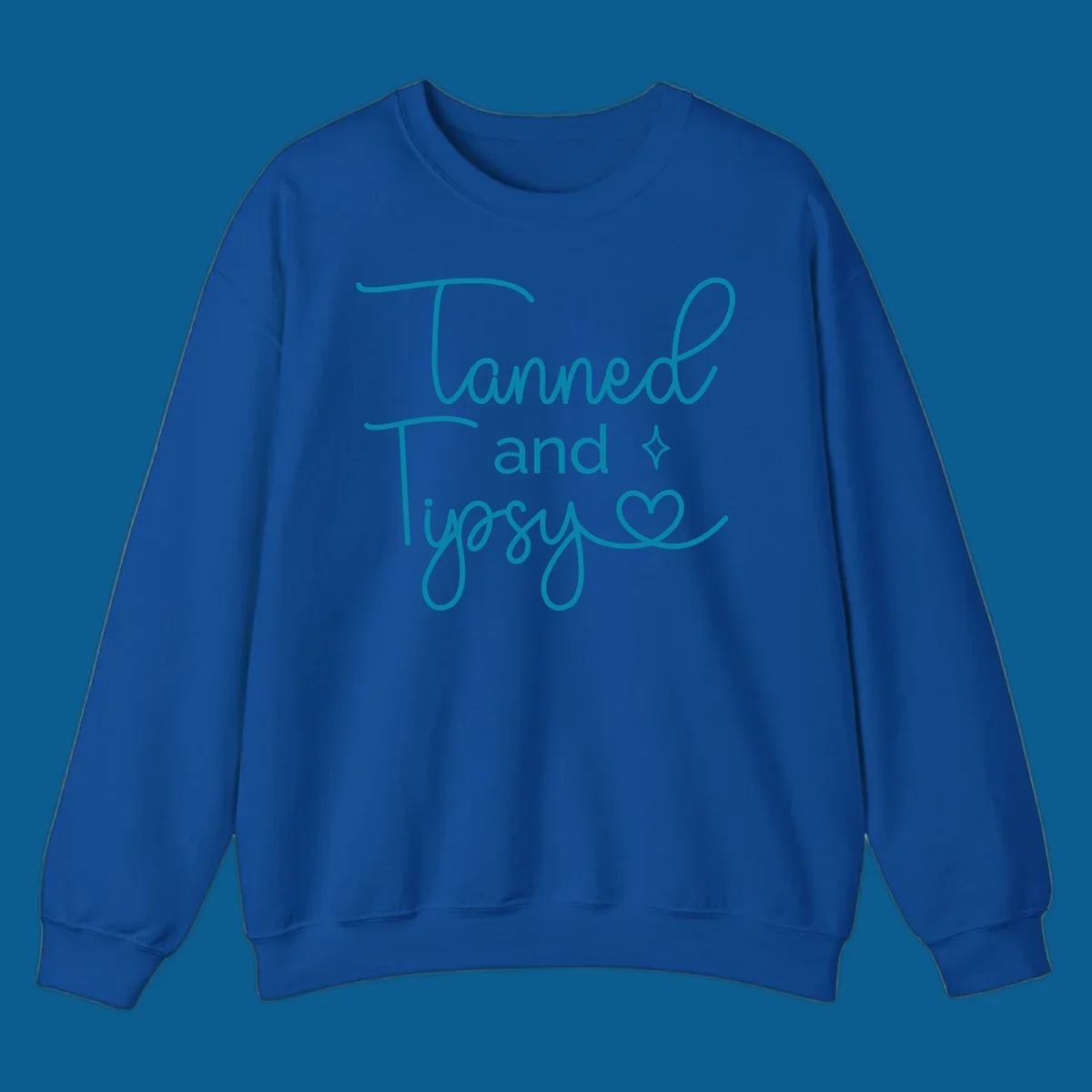 Tanned and Tipsy text with star and heart graphic