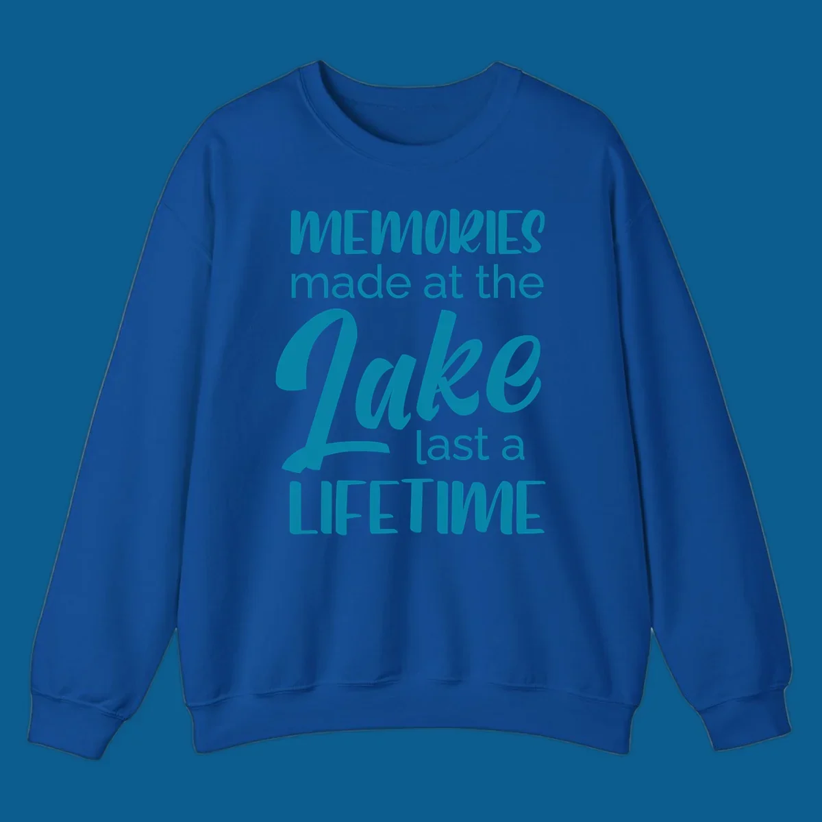 Typography design with the phrase "Memories made at the Lake last a Lifetime" in teal.